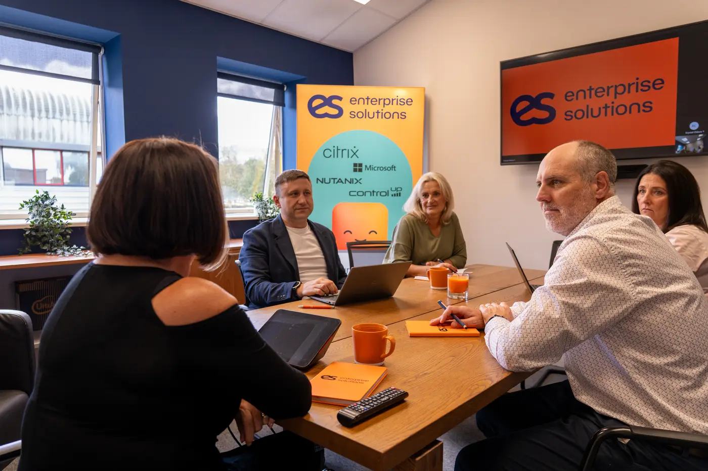 The team in a meeting in the Enterprise Solutions meeting room